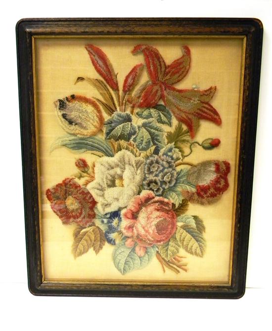 Appraisal: Floral stumpwork needlepoint framed behind glass repair loss of paint