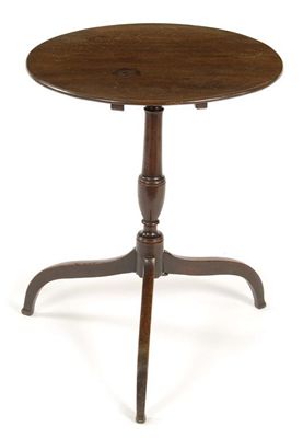 Appraisal: A mahogany tripod table the circular top on a turned