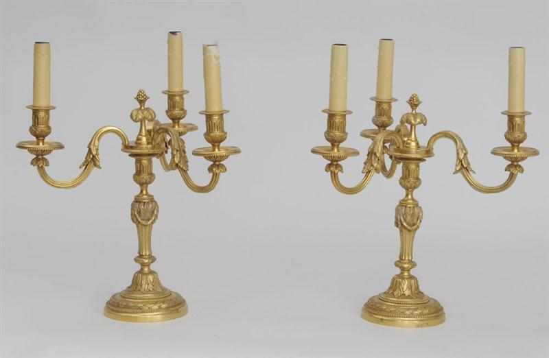 Appraisal: PAIR OF LOUIS XVI STYLE GILT-BRONZE THREE-LIGHT CANDELABRA Each fluted