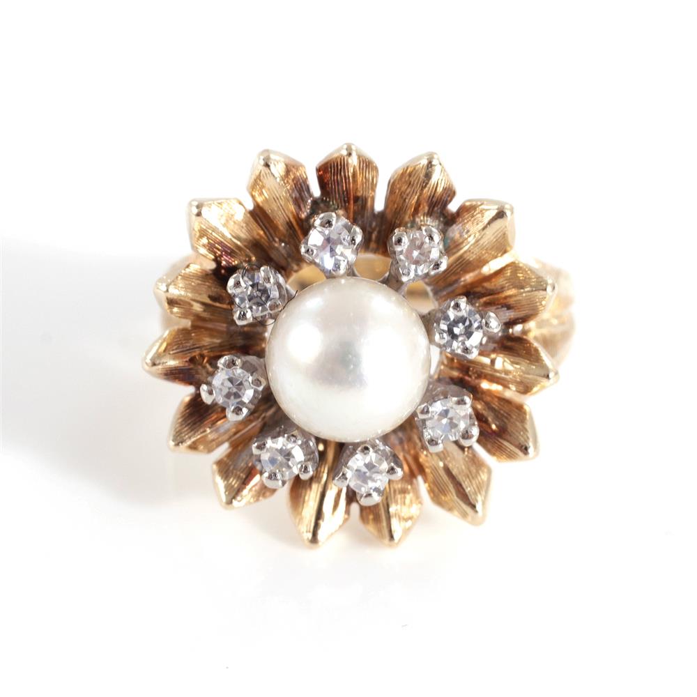 Appraisal: Pearl and diamond cocktail ring mm pearl centered with floriform