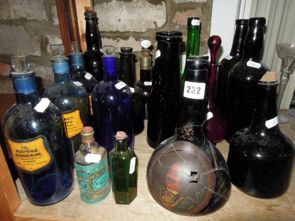 Appraisal: A collection of th century and other bottles including chemist