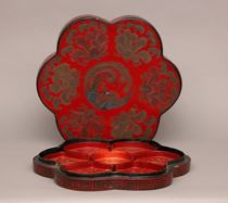 Appraisal: Lacquered Box th Century Stylish red flower-shaped box in which