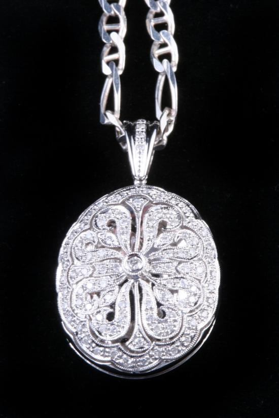 Appraisal: K WHITE GOLD AND DIAMOND LOCKET ON STERLING SILVER CHAIN