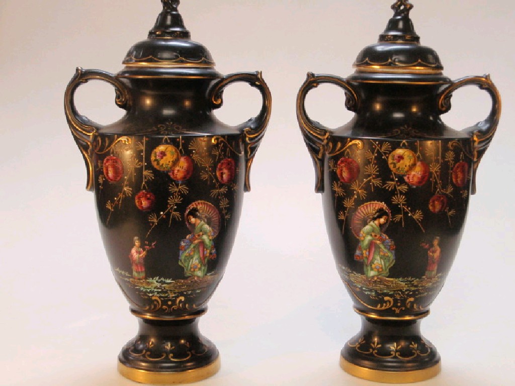 Appraisal: A pair of Bow Wood lidded urns with black background