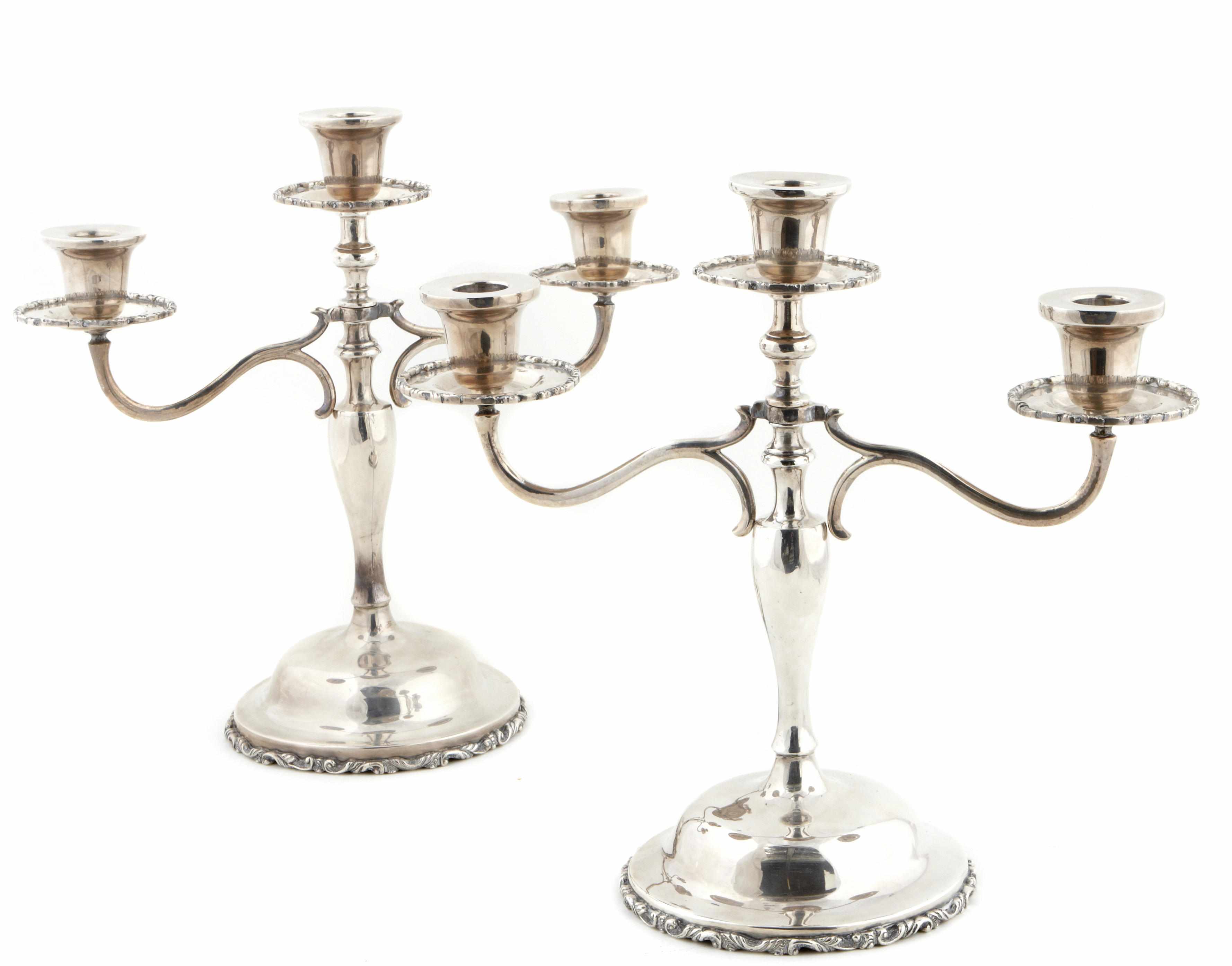 Appraisal: A pair of Mexican sterling silver three-light candelabra Perlita Mexico