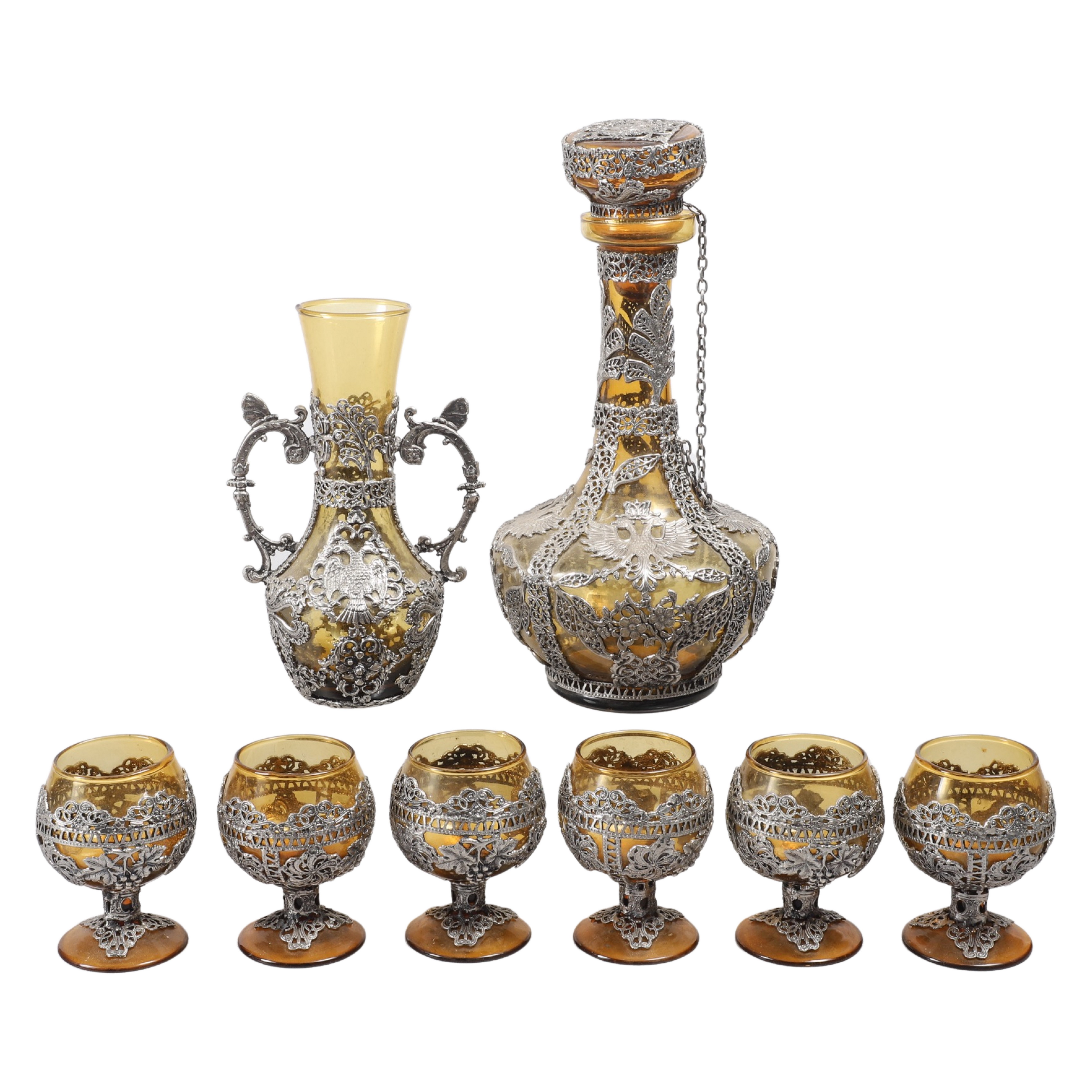 Appraisal: Continental white metal decanter set blown amber glass in heavy