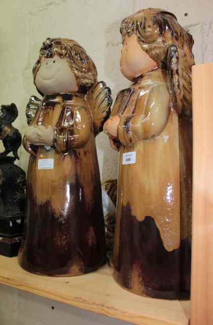 Appraisal: A BROWN GLAZED POTTERY CHRISTMAS ANGEL together with another similar