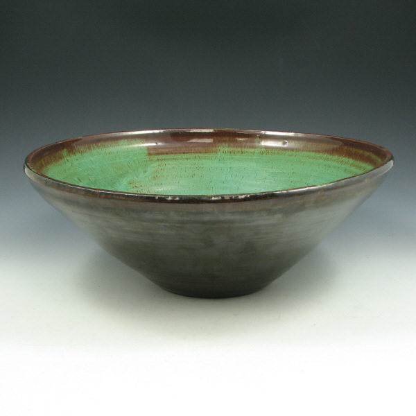 Appraisal: Margaret Pachl hand thrown bowl in glossy green and brown