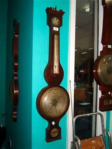 Appraisal: An early th Century mahogany wheel barometer with hygrometer thermometer