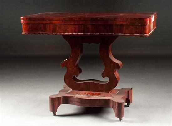 Appraisal: American Restoration mahogany flip-top games table circa with cupid's bow