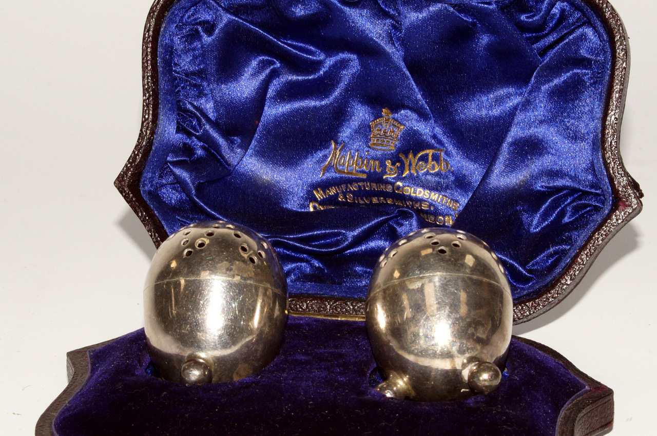 Appraisal: A pair of Edwardian silver ovoid pepperettes each on three