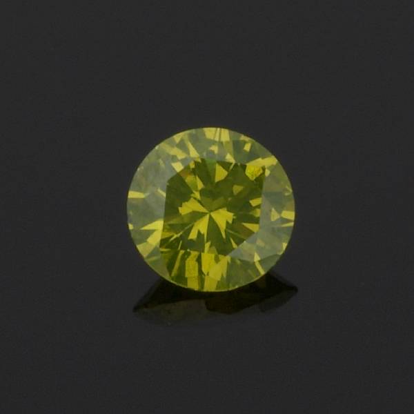 Appraisal: An unmounted colored diamond round brilliant-cut diamond weighing carats