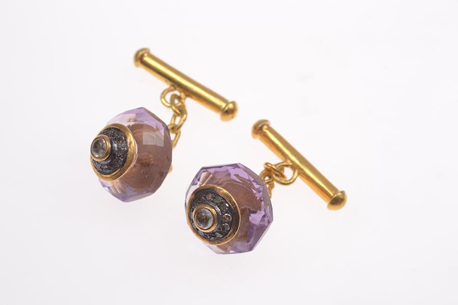 Appraisal: A PAIR OF AMETHYST AND DIAMOND MOONSTONE CUFFLINKS IN SILVER