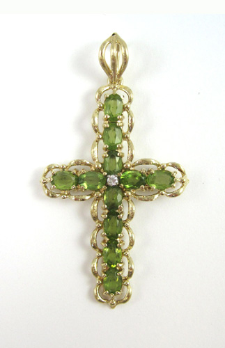 Appraisal: PERIDOT DIAMOND AND FOURTEEN KARAT GOLD PENDANT set with one