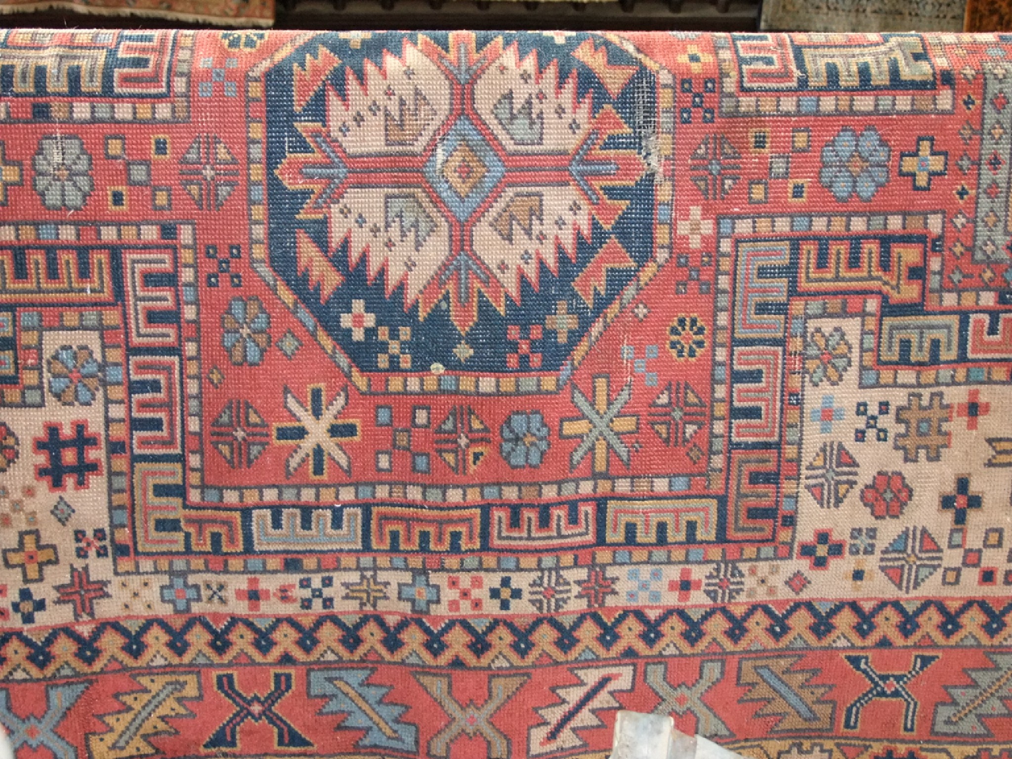 Appraisal: An old eastern woven wool rug with highly detailed decoration