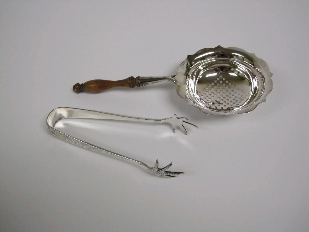 Appraisal: A George V Tea Strainer with baluster turned wooden handle