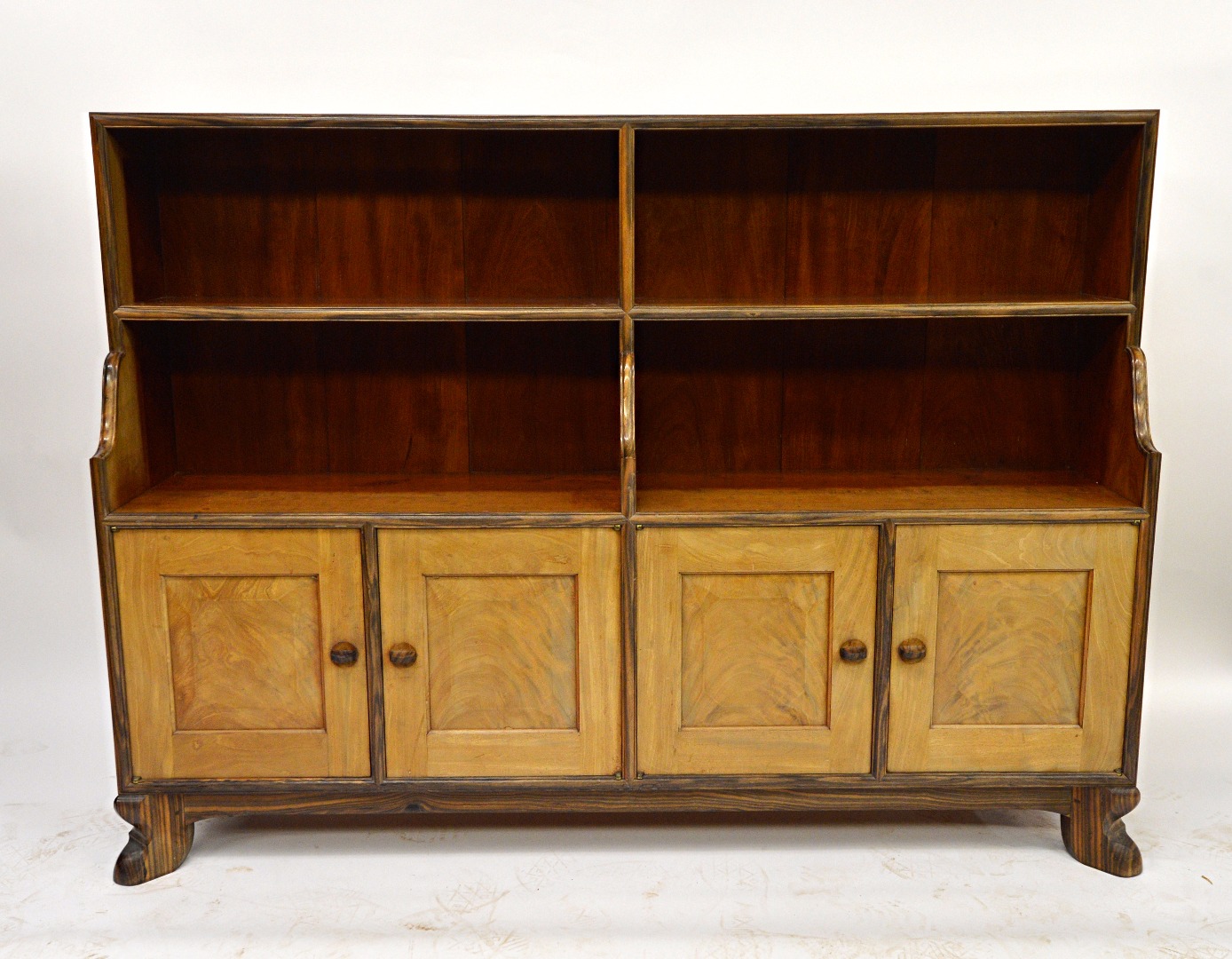 Appraisal: A fine Cuban mahogany and macassar ebony bookcase with cupboards