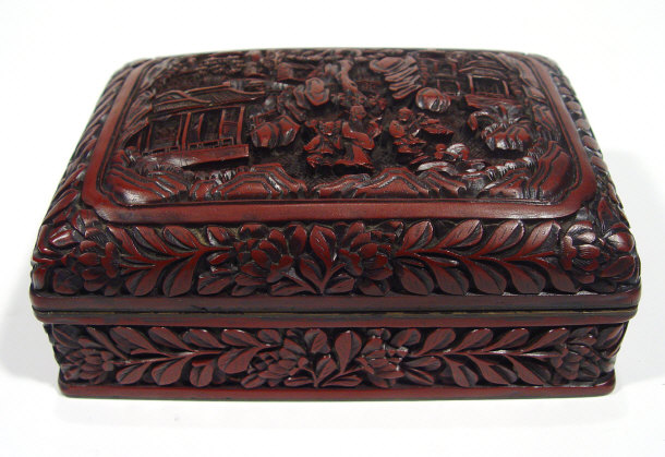 Appraisal: Oriental rectangular red lacquer box and cover carved with figures