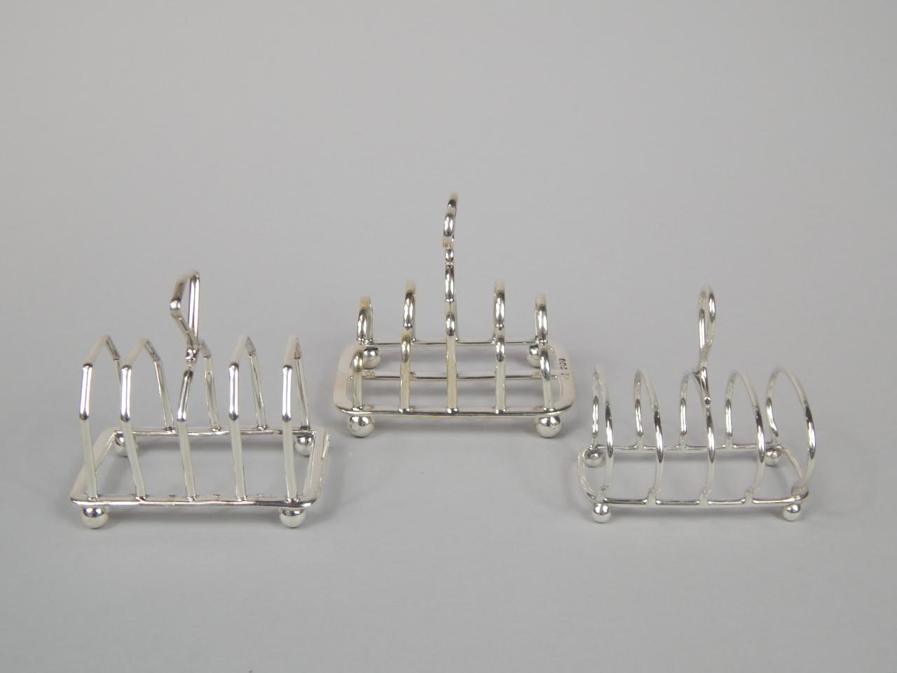 Appraisal: Three similar small four division toast racks each thC oz