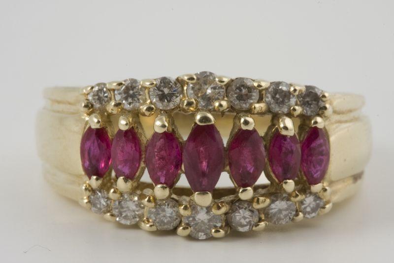 Appraisal: KT Diamond and Ruby Ring yellow gold with seven graduated