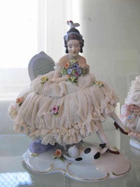 Appraisal: CONTINENTAL PORCELAIN LACE GROUP SEATED WOMAN IN DRESS WITH FLOWERS