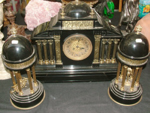 Appraisal: A late th century French slate and brass clock garniture