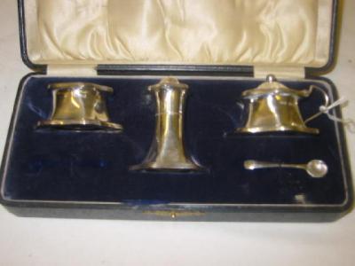 Appraisal: A THREE PIECE CONDIMENT SET of shaped circular form with