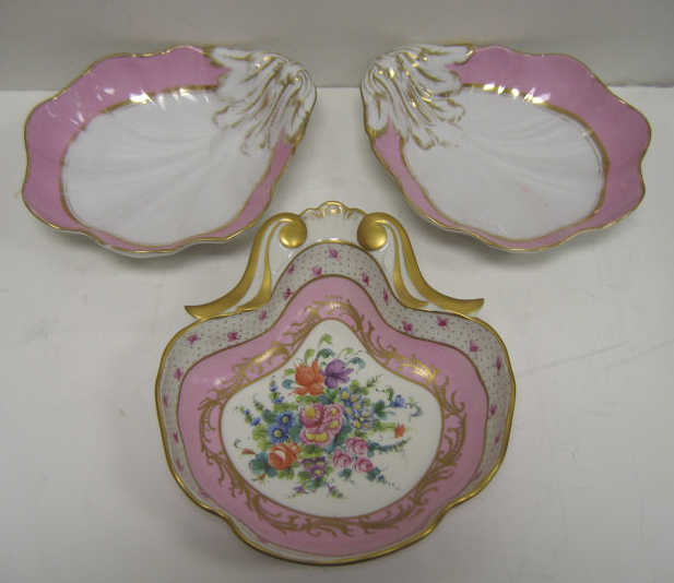 Appraisal: THREE FRENCH PORCELAIN SHELL-FORM DISHES A pair with embossed and