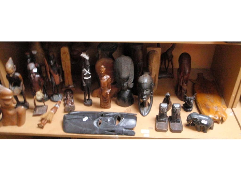 Appraisal: A collection of African tribal carved hardwood busts figures and