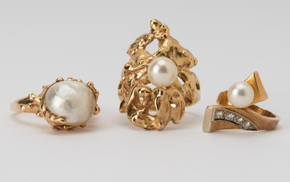 Appraisal: THREE ASSORTED KARAT YELLOW GOLD CULTURED PEARL RINGSone ring set