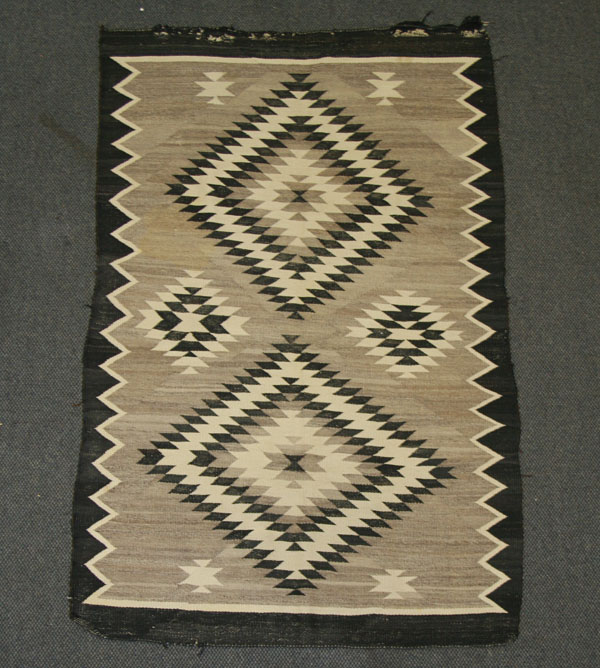 Appraisal: Two Navajo hand loomed rugs shaded monochromatic diamond patterns Largest