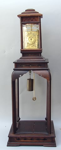 Appraisal: Rare Japanese lantern clock time and strike with double folliet