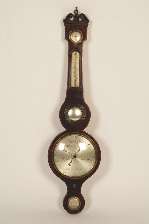 Appraisal: A REGENCY MAHOGANY WHEEL BAROMETER with a dry damp gauge