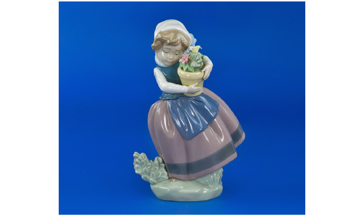 Appraisal: Lladro Figure Girl holding a pot with flowers No in