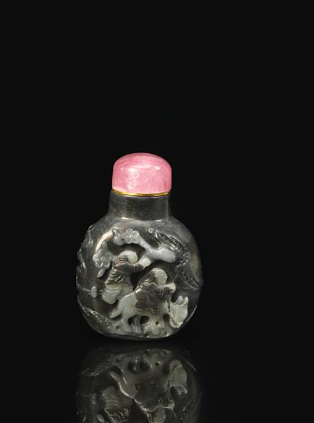 Appraisal: A large black and white jade snuff bottle Of a