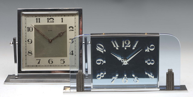 Appraisal: AN ART DECO MANTEL TIMEPIECE the blue tinted mirrored rectangular