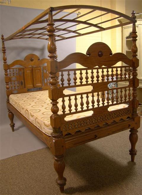 Appraisal: SRI LANKAN COLONIAL SOLID SATINWOOD CANOPY BED the headboard with