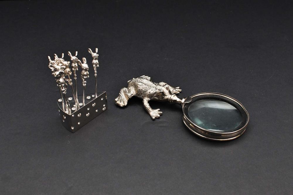 Appraisal: TWO SILVER PLATE WHIMSICAL TABLE ITEMSModern The first a magnifying