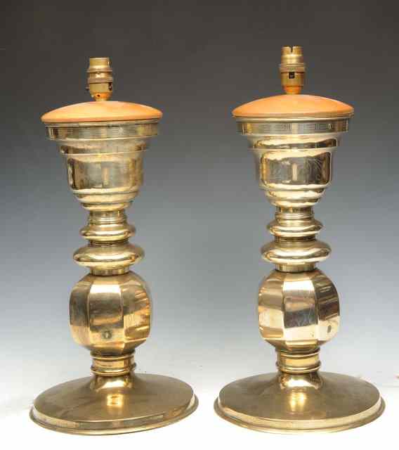 Appraisal: A PAIR OF ORIENTAL TURNED AND ENGRAVED BRASS TABLE LAMPS