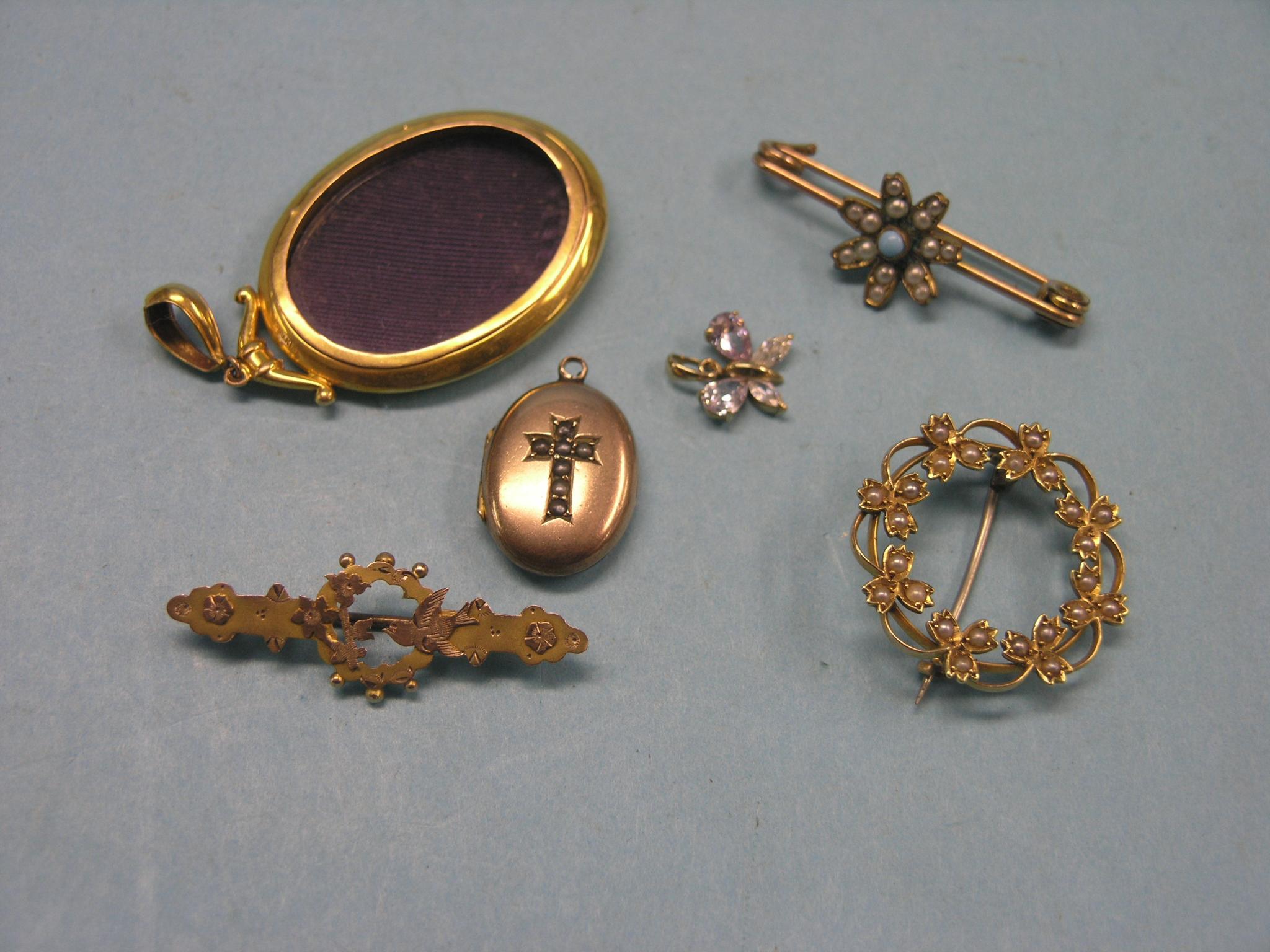 Appraisal: A ct gold locket pendant three various brooches ct gold