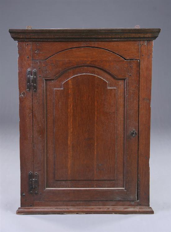 Appraisal: ENGLISH GEORGIAN CORNER CABINET early-to-mid th century oak Molded-edge triangular