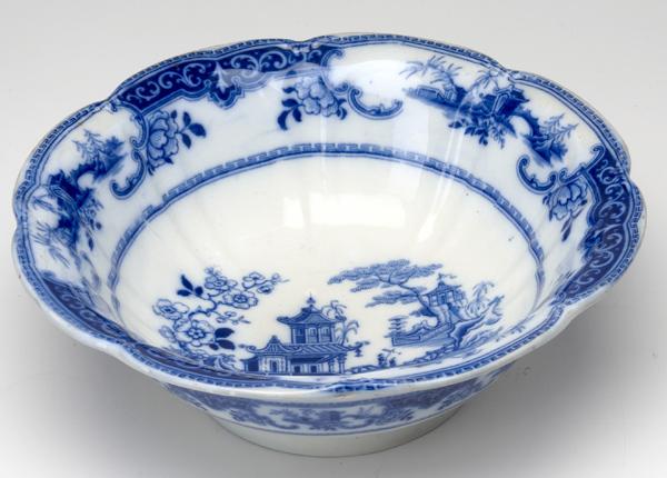 Appraisal: FLOW-BLUE English Ironstone centerpiece bowl in the Peking pattern dia