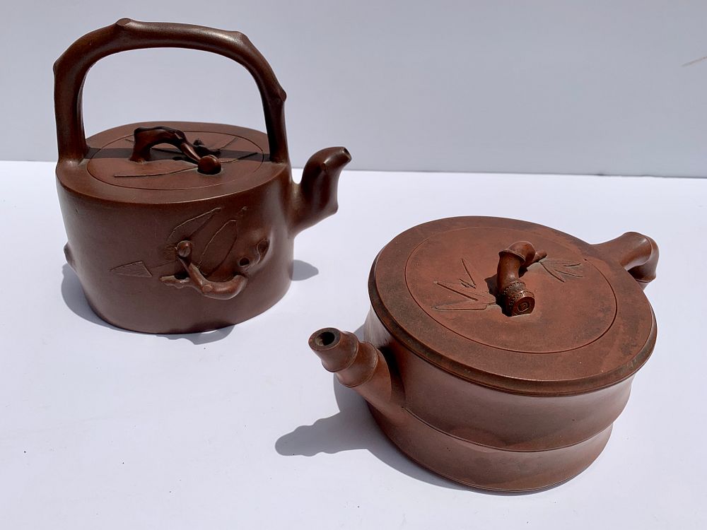 Appraisal: Two Decorated Chinese Yixing Teapots Qing dynasty bamboo form teapot