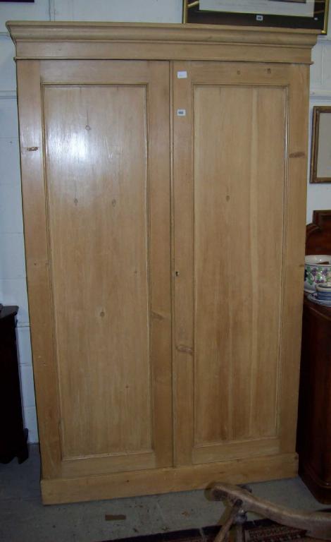 Appraisal: A Victorian stripped pine two door wardrobe with fitted interior