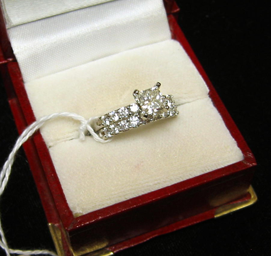 Appraisal: LADY'S DIAMOND AND FOURTEEN KARAT WHITE GOLD WEDDING ENSEMBLE centering