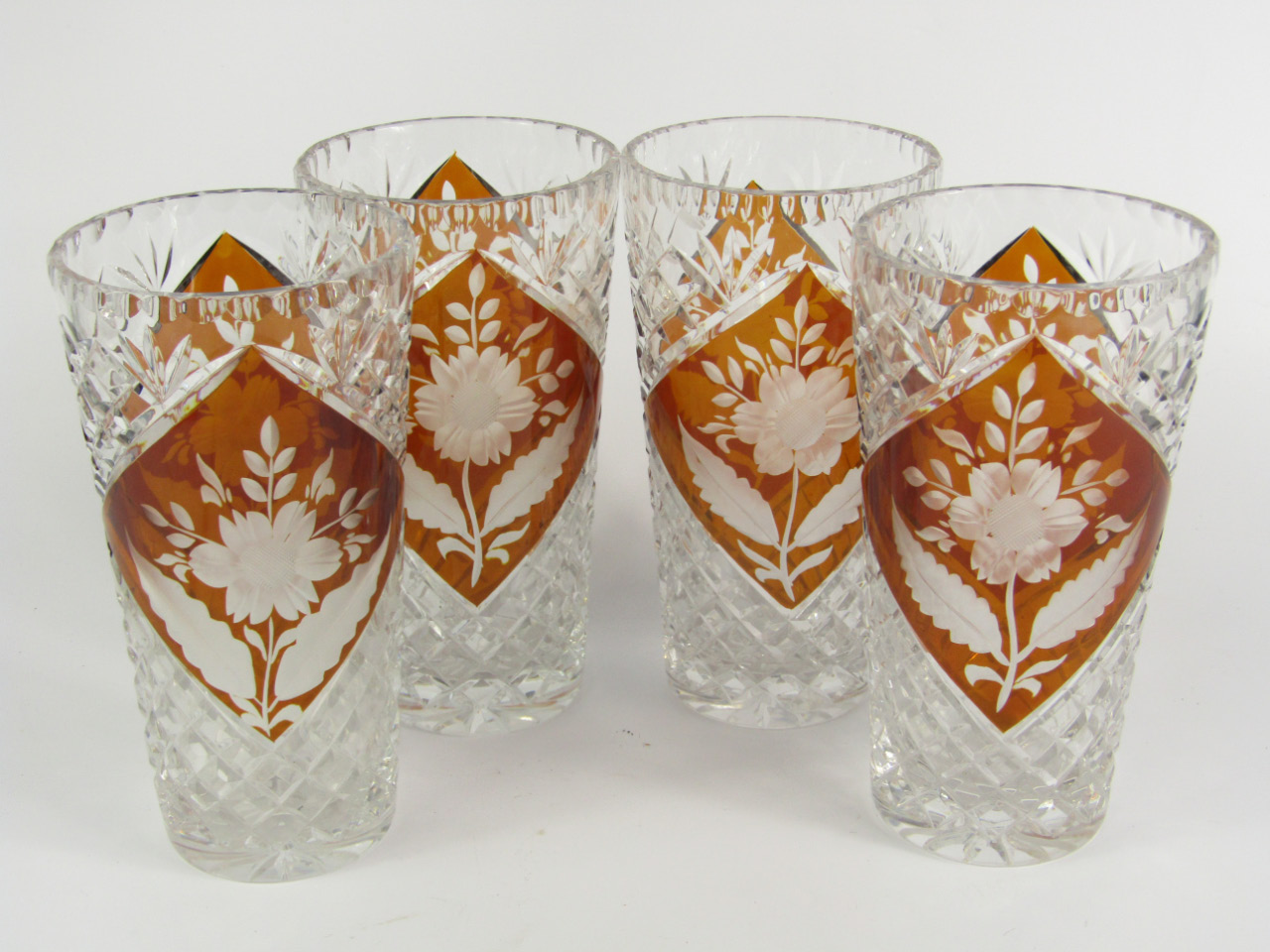 Appraisal: A set of four Bohemian cut and amber flashed glass