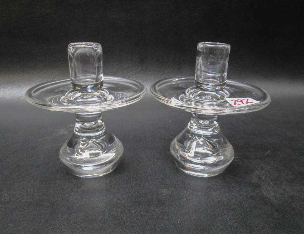 Appraisal: PAIR STEUBEN CRYSTAL TEARDROP CANDLESTICKS with single lights engraved Steuben