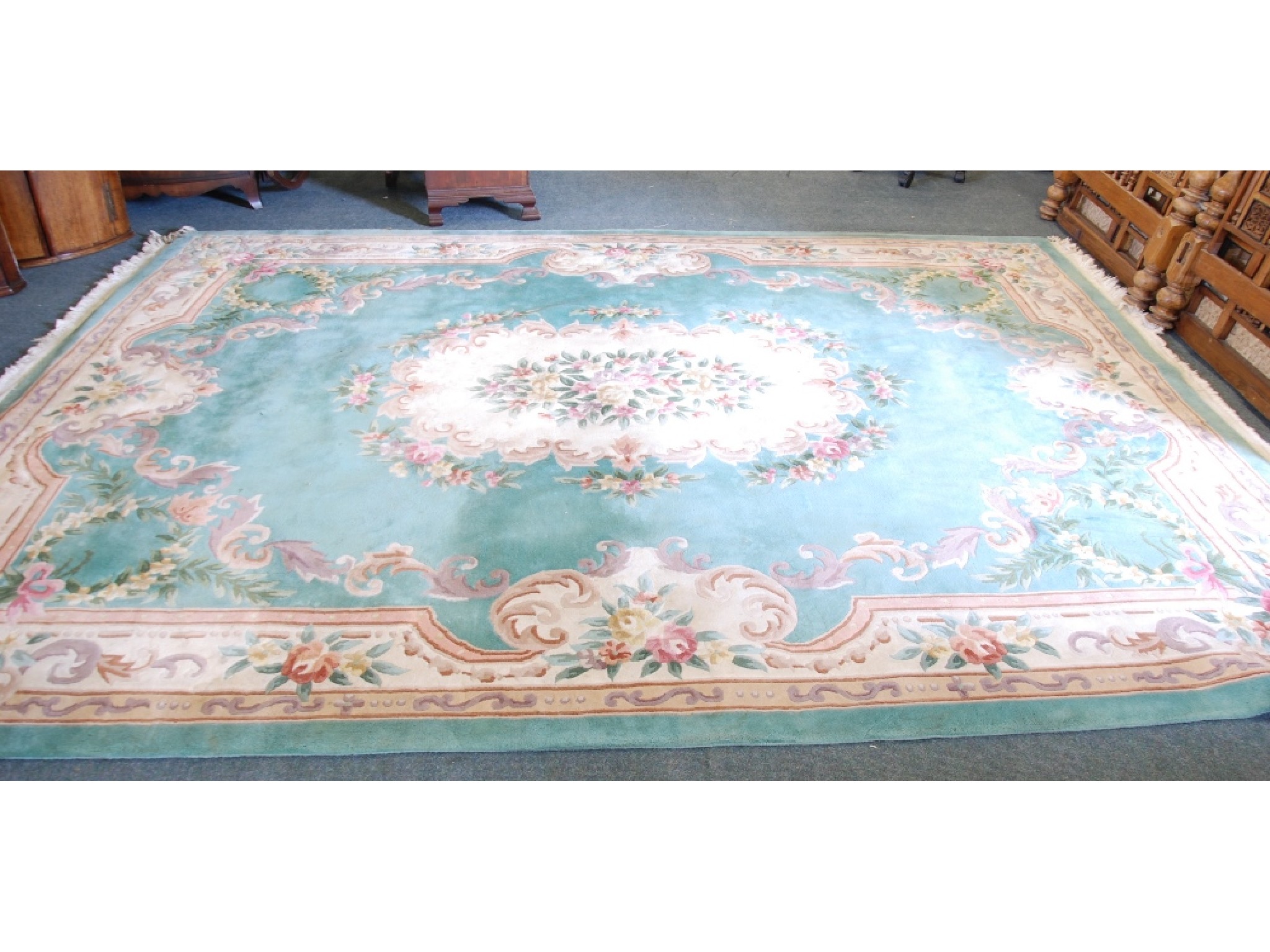 Appraisal: A WASHED CHINESE CARPET OF EMBOSSED AUBUSSON DESIGN with green