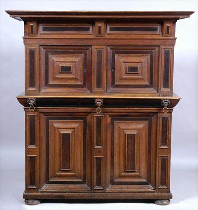 Appraisal: NORTHERN EUROPEAN OAK AND EBONIZED THREE-PART CABINET The molded overhang