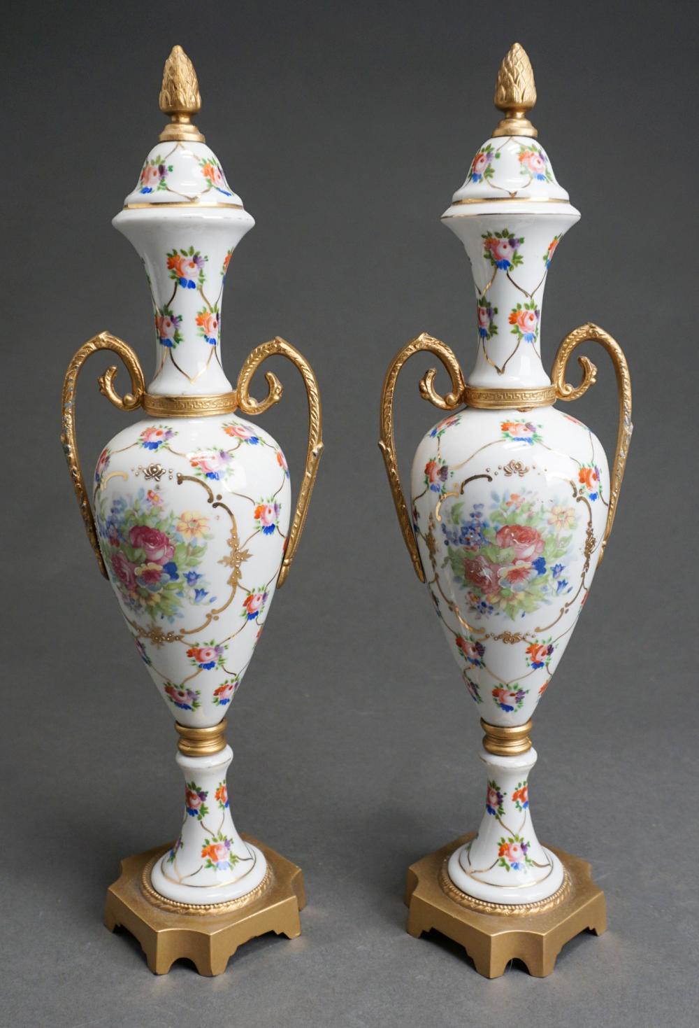 Appraisal: PAIR EUROPEAN GILT METAL AND PORCELAIN COVERED AMPHORAS H IN